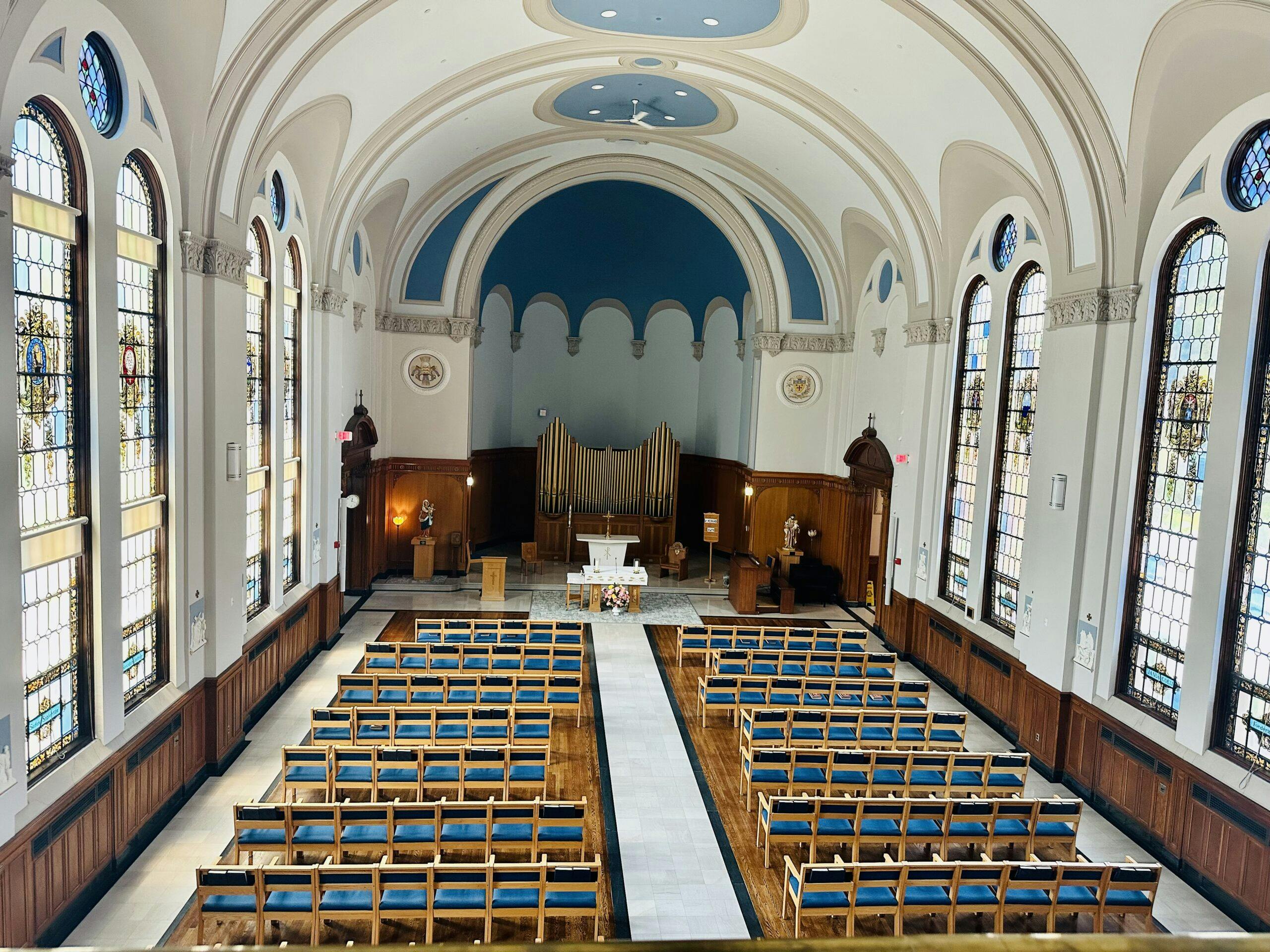 Du Lac Chapel, a church with rows of blue chairs.