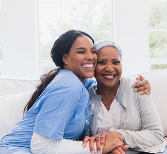 A nurse hugging a patient
