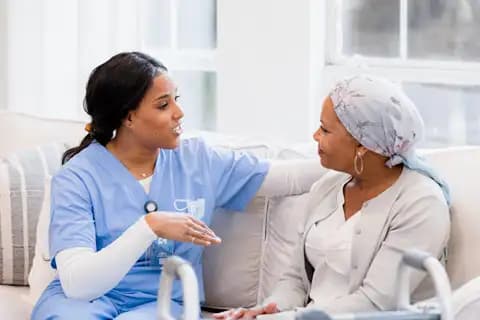 A nurse talking to a patient