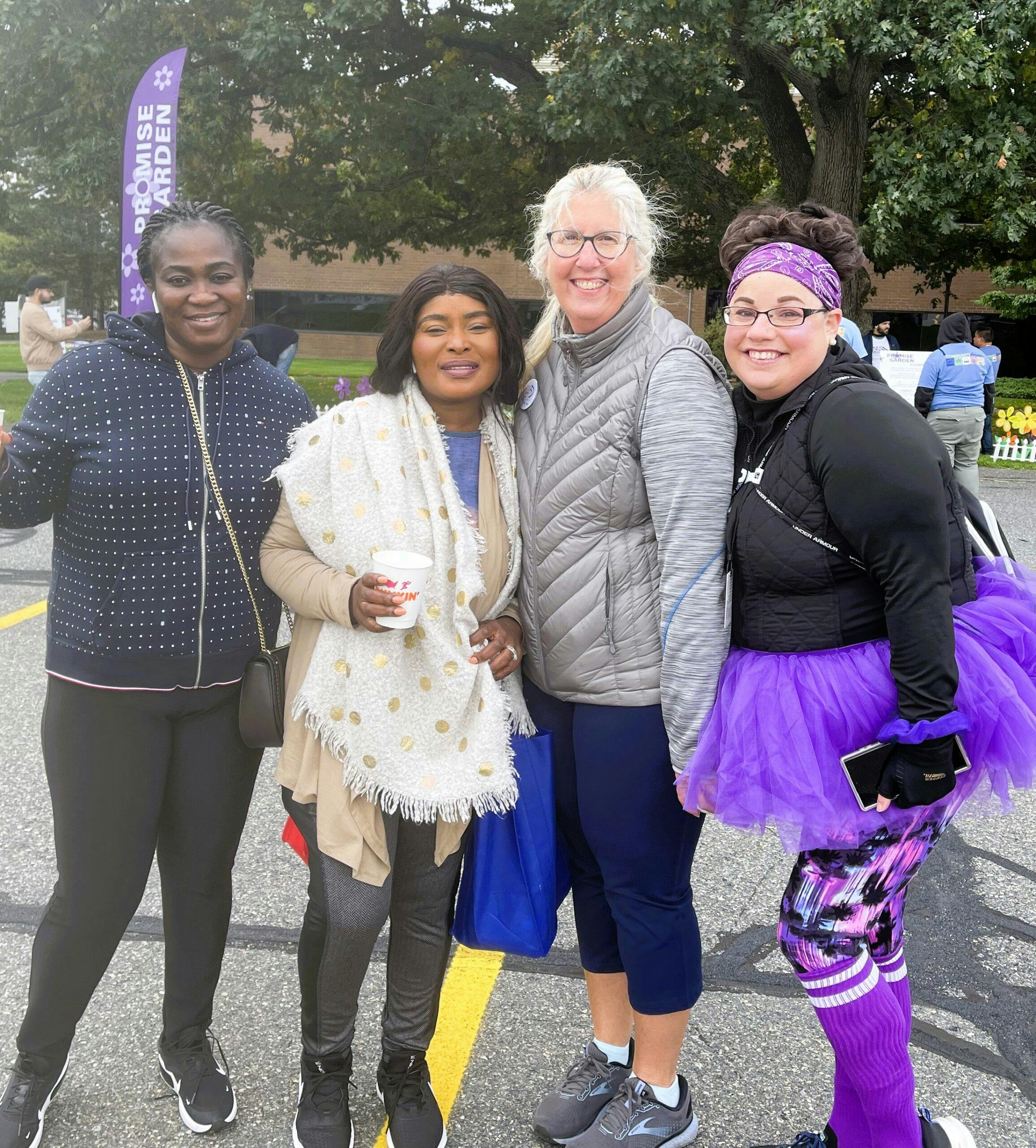 Four women posing for a photo at an Alzheimer's Association event.